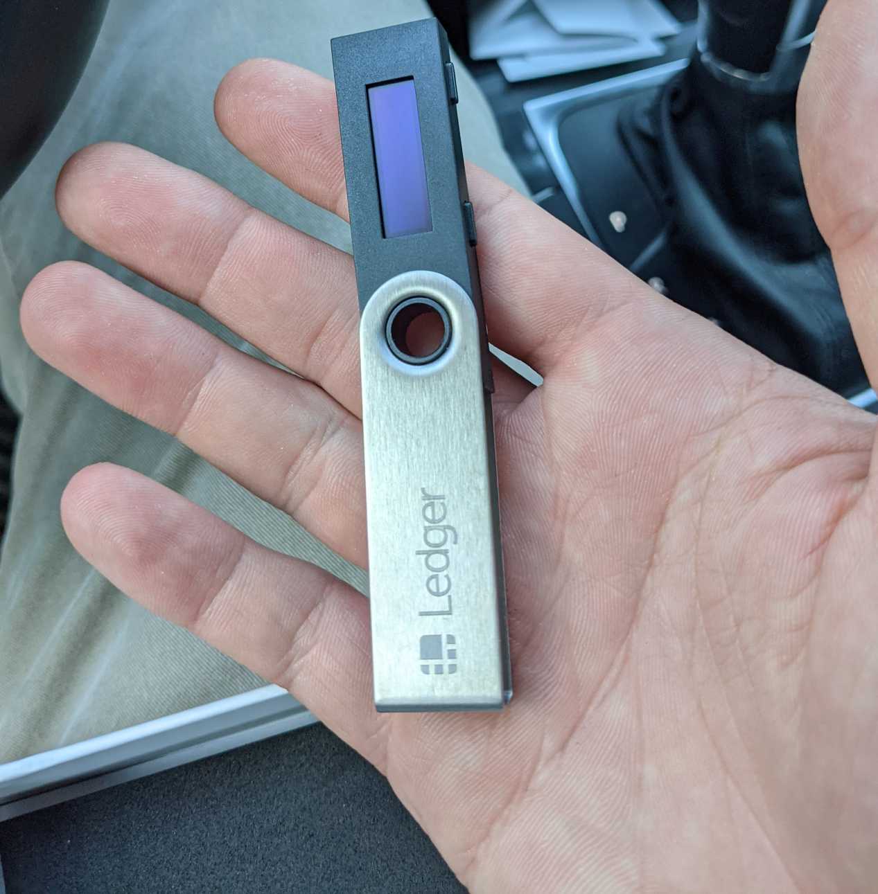 Image of Ledger Nano S in my palm. It’s about the size of a USB stick